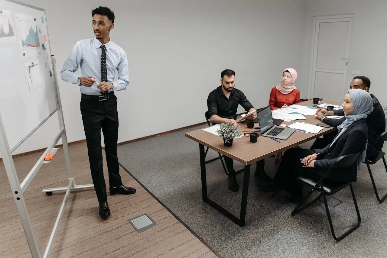 A diverse group of professionals collaborating in a modern office meeting.